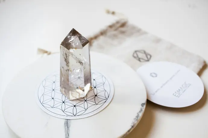a diamond sitting on top of a white plate
